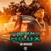 Dentro da Hilux